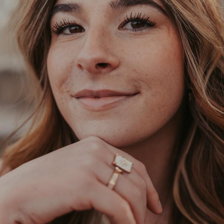 Kaveri Mehta, Lead Design Curator at Cedar Field Bank, reviewing corporate floral arrangements